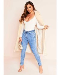 Missy Empire - Missy Empire 5 Pocket Mid Wash Skinny Jeans - Lyst
