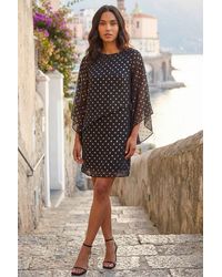 Roman - Asymmetric Spot Print Overlay Dress - Lyst
