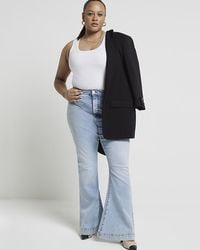 River Island - Mid Rise Tummy Hold Flare Jeans - Lyst
