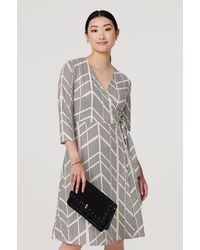 Izabel London - Cream Printed 3/4 Sleeve Knee Length Wrap Dress - Lyst
