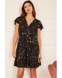 Mela London - Foil Star Print Wrap Skater Dress - Lyst