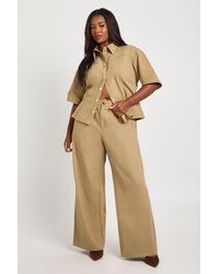 Boohoo - Plus Twill Pleat Front Wide Leg Trouser - Lyst