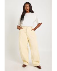 Boohoo - Plus Mid Waist Twisted Seam Barrel Leg Jean - Lyst