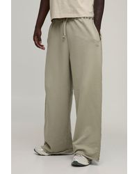 BoohooMAN - Extreme Wide Leg Loopback Embroidered Raw Hem Joggers - Lyst