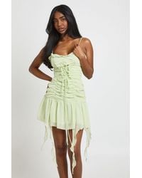 Boohoo - Textured Chiffon Lace Up Front Mini Dress - Lyst