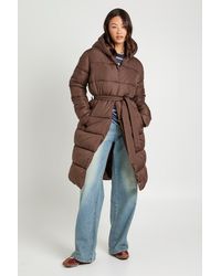 Boohoo - Tall Belted Longline Puffer Jacket - Lyst
