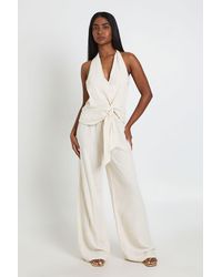 Boohoo - Halterneck Linen Look Knot Front Wide Leg Jumpsuit - Lyst