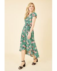 Mela London - Animal Print Dipped Hem Wrap Dress - Lyst