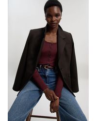 Karen Millen - Viscose Rib Button Up Scoop Neck Long Sleeve Bodysuit - Lyst