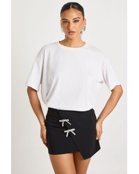 Boohoo - Bengaline Mini Skirt With Diamante Bow Detail - Lyst