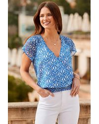 Sosandar - Sky Metallic Geometric Print Shirred Hem Wrap Top - Lyst