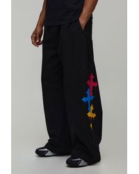 BoohooMAN - Extreme Parachute Fit Cross Embroidered Trousers - Lyst