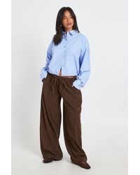 Boohoo - Petite Cord Drawstring Waist Wide Leg Trouser - Lyst