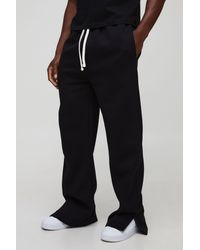 BoohooMAN - Relaxed Fit Flared Split Hem Sweatpants - Lyst