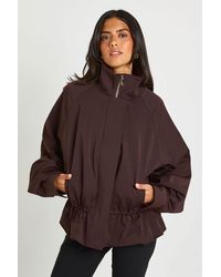 Boohoo - Cinched Waist Funnel Neck Jacket - Lyst