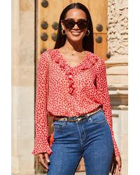 Sosandar - Spot Print Ruffle Sleeve Fluted Cuff Blouse Denim - Lyst