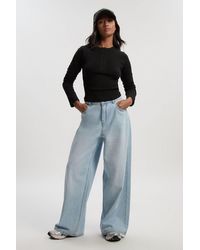 Boohoo - Petite Mid Waist Loose Fit Wide Leg Jean - Lyst