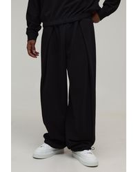 BoohooMAN - Balloon Fit Pleated Loopback Jogger - Lyst