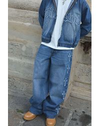 BoohooMAN - Baggy Fit Cross Applique Washed Jeans - Lyst