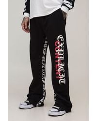 BoohooMAN - Tall Relaxed Flare Gothic Print Joggers - Lyst