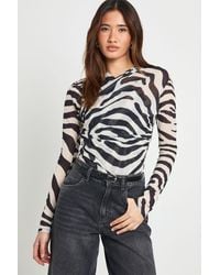 Boohoo - Zebra Mesh Flare Sleeve Cross Over Bodysuit - Lyst