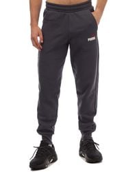 PUMA - Ess+ 2 Col Logo Track Pants - Lyst