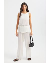 Hiccup - Round Neck Plisse Blouse With A Belt Detail - Lyst