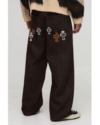 BoohooMAN - Baggy Fit Cow Cross Applique Jeans - Lyst