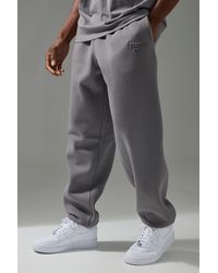 BoohooMAN - Active Training Dept Oversized Embossed Sweatpants - Lyst
