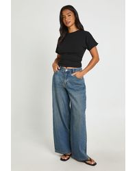 Boohoo - Petite Mid Waist Loose Wide Leg Jean - Lyst