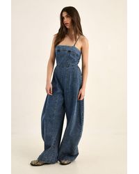 Nasty Gal - Strappy Seam Detail Wide Leg Denim Jumpsuit - Lyst