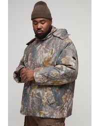 BoohooMAN - Plus Oversized Forest Camo Hooded Funnel Neck Puffer Jacket - Lyst
