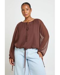 Boohoo - Plus Ruched Tie Front Balloon Sleeve Blouse - Lyst