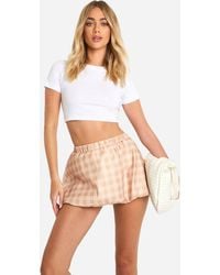 Boohoo - Boxer Flannel Puff Ball Micro Mini Skirt - Lyst