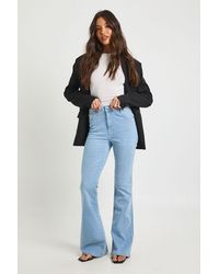 Boohoo - High Waist Booty Lifting Flared Jean - Lyst