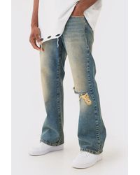 BoohooMAN - Relaxed Flare Rigid Knee Rip Tinted Denim Jean - Lyst