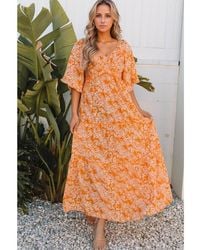 Everyday the Label - Dames Maxi Jurk Met V-hals En Brede Mouwen In Bloemenprint Met Rimpeling - Lyst