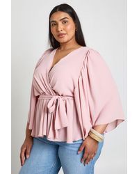 Boohoo - Plus Angel Sleeve Wrap Peplum Blouse - Lyst