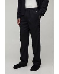 BoohooMAN - Tall Relaxed Fit Irregular Pleat Texture Trousers - Lyst