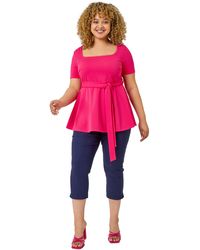 Roman Curve - Stretch Belted Peplum Top - Lyst
