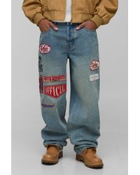 BoohooMAN - Relaxed Varsity Badge Washed Denim Jeans - Lyst