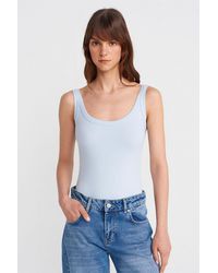 Dilvin - Sleeveless Ribbed Cotton-Blend Bodysuit - Lyst