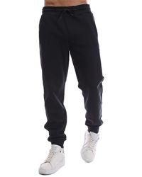 EA7 - Emporio Armani Solid Patterned Slim Joggers - Lyst