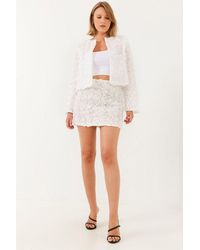 Bianco Lucci - Lace Textured Mini Skirt With Flower Pattern - Lyst