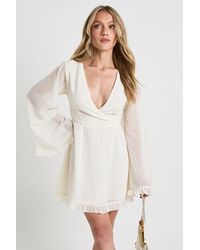 Boohoo - Petite Dobby Flare Sleeve Wrap Mini Dress - Lyst