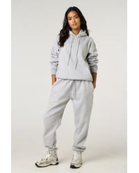 Femme Luxe - Front Pocket Pullover Hoodie Cuffed Joggers Loungewear Set - Lyst