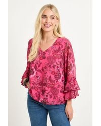 Wallis - Petite Floral Flute Sleeve Top - Lyst
