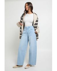 Boohoo - Mid Waist Twisted Seam Barrel Leg Jean - Lyst