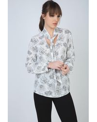 Conquista - Long Sleeve Floral Top With Neck Tie Detail And Button Cuffs By Fashion - Lyst