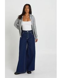 Boohoo - The Petite Mid Waist Wide Leg Jean - Lyst